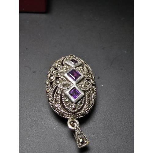 174 - A stunning art deco style hallmarked silver locket inset with 3 faceted genuine amethyst stones surr... 