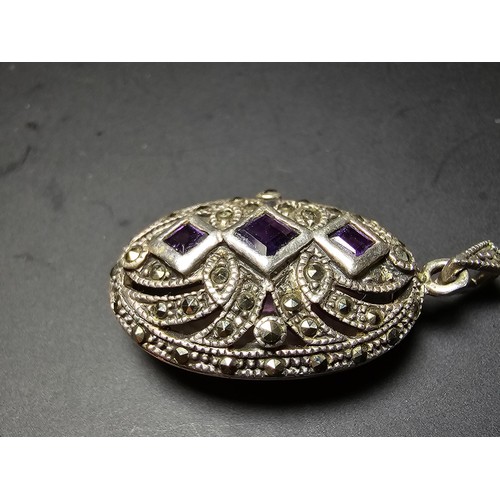 174 - A stunning art deco style hallmarked silver locket inset with 3 faceted genuine amethyst stones surr... 