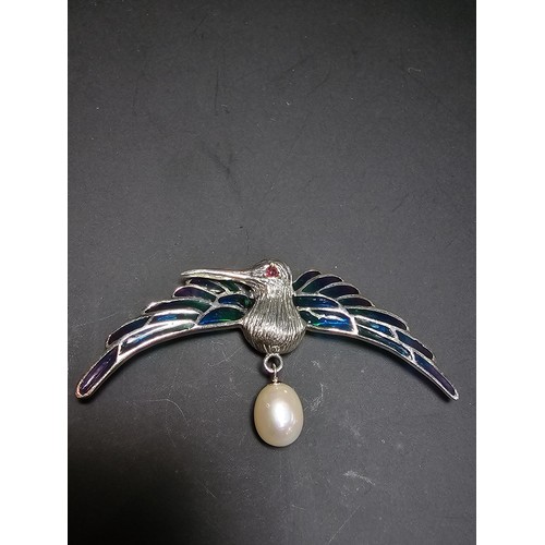 175 - A stunning 925 silver pique a jour bird formed brooch featuring colourful stained glass backing to t... 