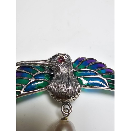 175 - A stunning 925 silver pique a jour bird formed brooch featuring colourful stained glass backing to t... 