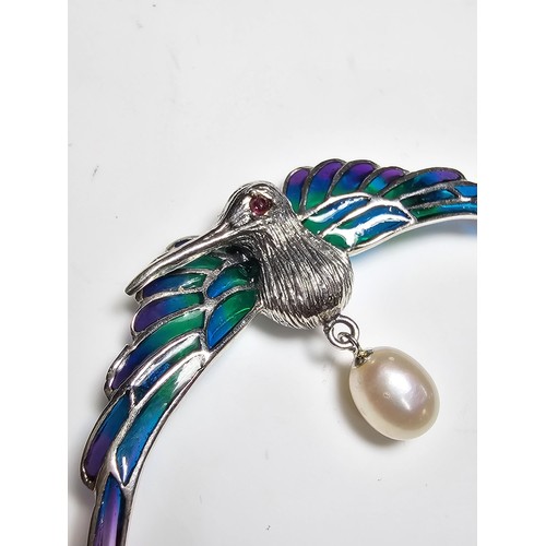 175 - A stunning 925 silver pique a jour bird formed brooch featuring colourful stained glass backing to t... 