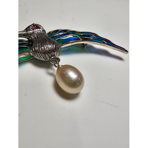 175 - A stunning 925 silver pique a jour bird formed brooch featuring colourful stained glass backing to t... 