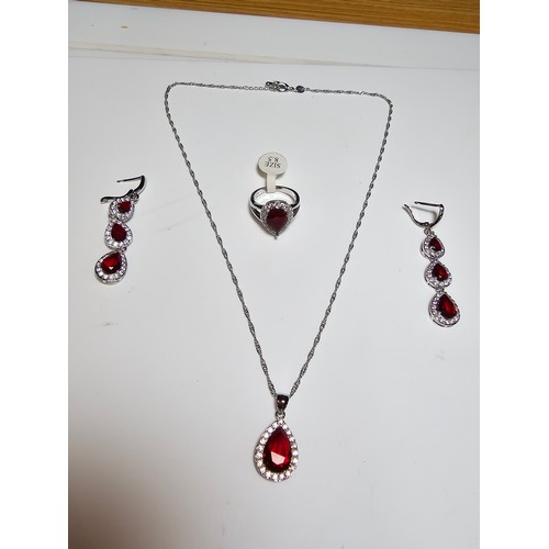 179 - A brand new 925 silver plated matching jewellery set which includes long drop earrings, pendant, nec... 