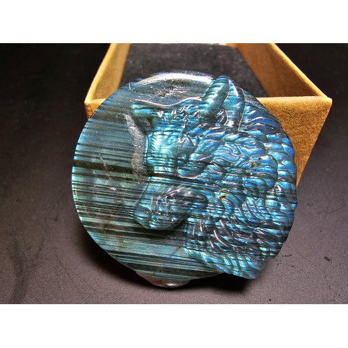 180 - A stunning carved labradorite stone specimen featuring a wolf design, the labradorite has beautiful ... 