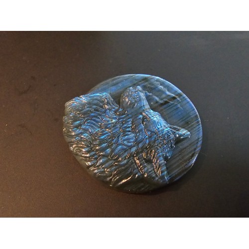 180 - A stunning carved labradorite stone specimen featuring a wolf design, the labradorite has beautiful ... 