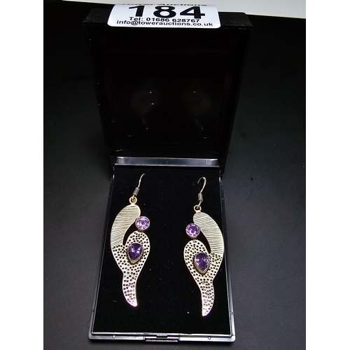 184 - Pair of impressive 925 silver long 5.5cm drop earrings with a handmade design, inset with faceted pu... 