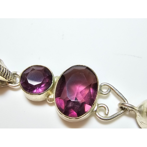 187 - An Impressive 925 silver long drop pendant inset with 3x faceted crystal purple glass stones, in exc... 