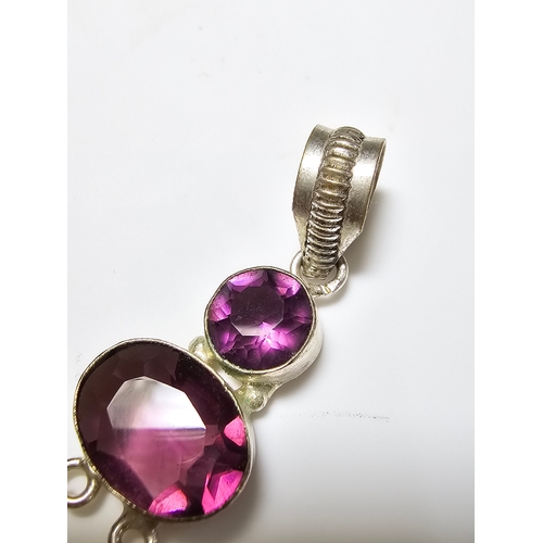 187 - An Impressive 925 silver long drop pendant inset with 3x faceted crystal purple glass stones, in exc... 