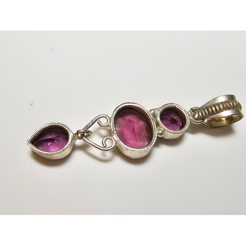 187 - An Impressive 925 silver long drop pendant inset with 3x faceted crystal purple glass stones, in exc... 