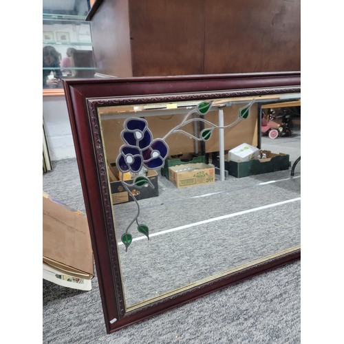 83 - A good quality mahogany framed mirror with a leaded floral design one side in good overall condition... 