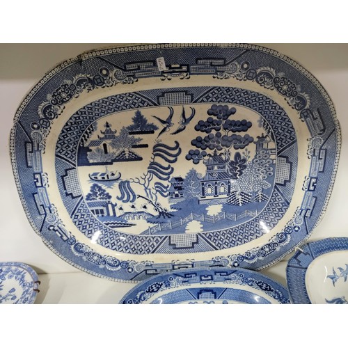 91 - Quantity of vintage blue and white plates inc Royal Doulton, Booths etc, one dish has a cip to the r... 