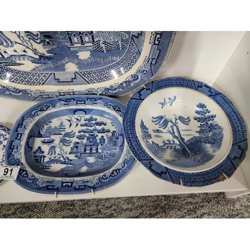 91 - Quantity of vintage blue and white plates inc Royal Doulton, Booths etc, one dish has a cip to the r... 