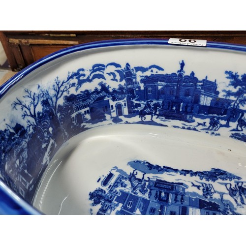 99 - Good quality Victoria ware ironstone foot bath / planter in a blue and white glaze with handles to t... 