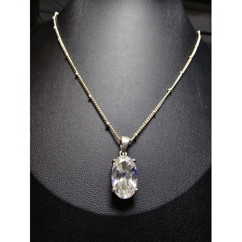 195 - An pretty 925 silver large faceted crystal pendant on an attractive 18