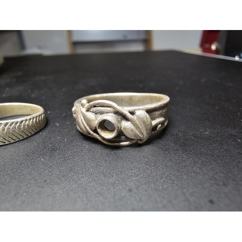 196 - A bundle of 2x 925 silver rings, 1 with a Rennie Mackintosh design (missing stone), the other ring h... 