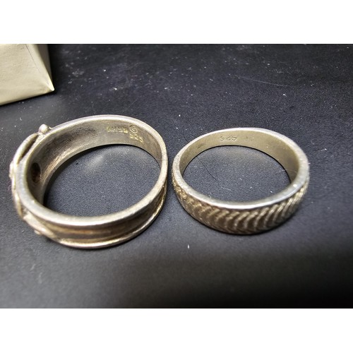 196 - A bundle of 2x 925 silver rings, 1 with a Rennie Mackintosh design (missing stone), the other ring h... 