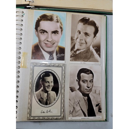 126 - 2x green albums containing a large quantity of Hollywood stars of the past inc Robert Kent, Dick Pow... 