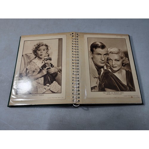 126 - 2x green albums containing a large quantity of Hollywood stars of the past inc Robert Kent, Dick Pow... 