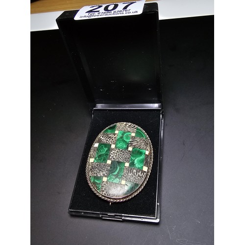 207 - An impressive large vintage Scottish brooch inlaid with various hard stones which includes green mal... 