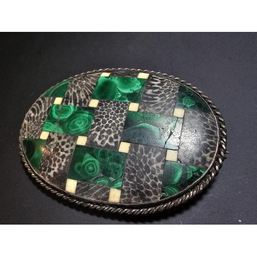 207 - An impressive large vintage Scottish brooch inlaid with various hard stones which includes green mal... 