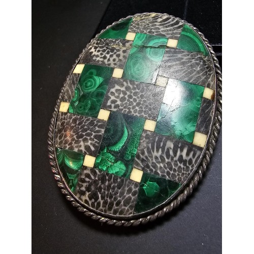 207 - An impressive large vintage Scottish brooch inlaid with various hard stones which includes green mal... 