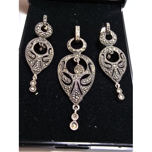 215 - A pretty matching art deco style 925 silver jewellery set to include drop pendant and drop earrings,... 