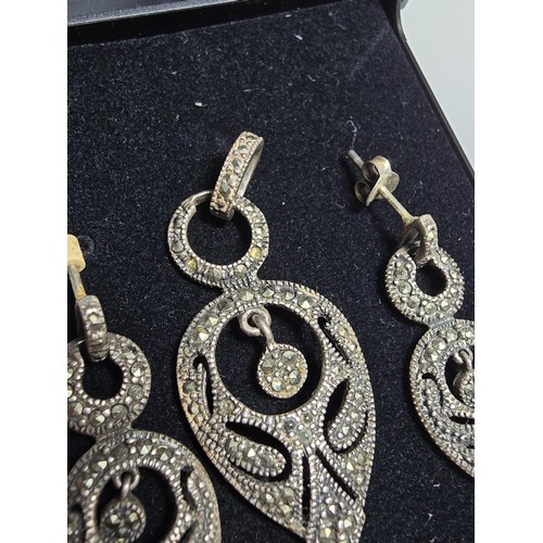 215 - A pretty matching art deco style 925 silver jewellery set to include drop pendant and drop earrings,... 