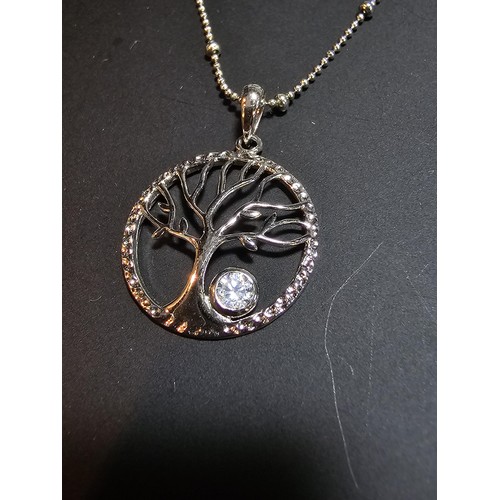 217 - A brand new pretty 925 silver tree of life pendant set on an attractive 18