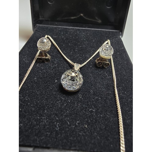 218 - A 925 silver matching jewellery set to include a pendant, chain and matching stud earrings, all with... 