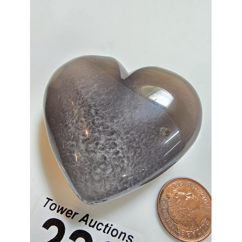 229 - A large carved chalcedony hard stone heart presenting a good natural translucent colour and grain, p... 