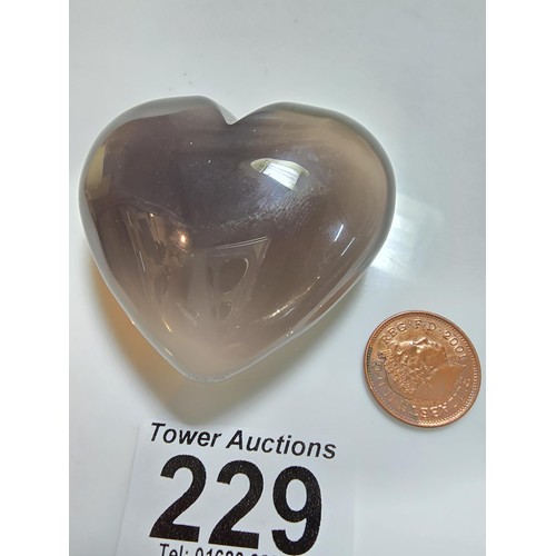 229 - A large carved chalcedony hard stone heart presenting a good natural translucent colour and grain, p... 