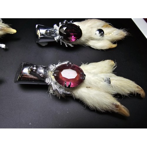 229B - A collection of 4x Scottish genuine grouse foot brooches all of a similar design featuring a stags h... 