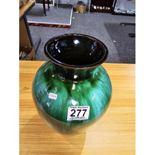 277 - A large impressive terracotta vase with a green and black glaze having a nice lustre by Blue Mountai... 