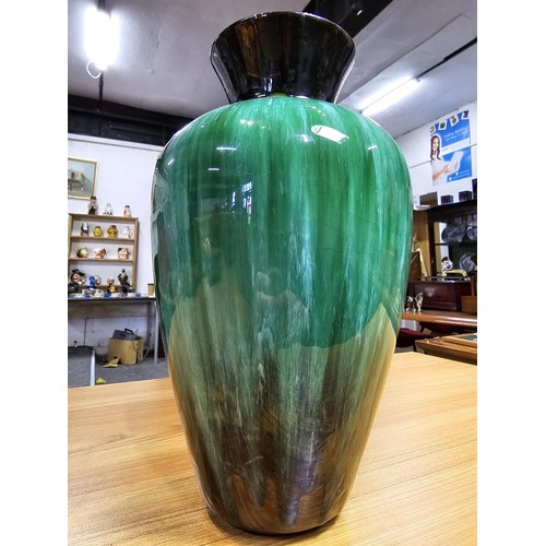 277 - A large impressive terracotta vase with a green and black glaze having a nice lustre by Blue Mountai... 