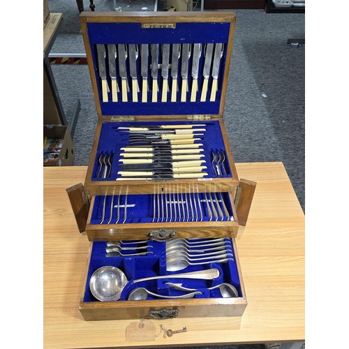 292 - A fine quality and impressive oak cased canteen of cutlery for 12 places by Walker & Hall, all but t... 