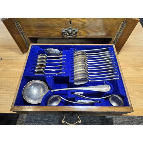 292 - A fine quality and impressive oak cased canteen of cutlery for 12 places by Walker & Hall, all but t... 