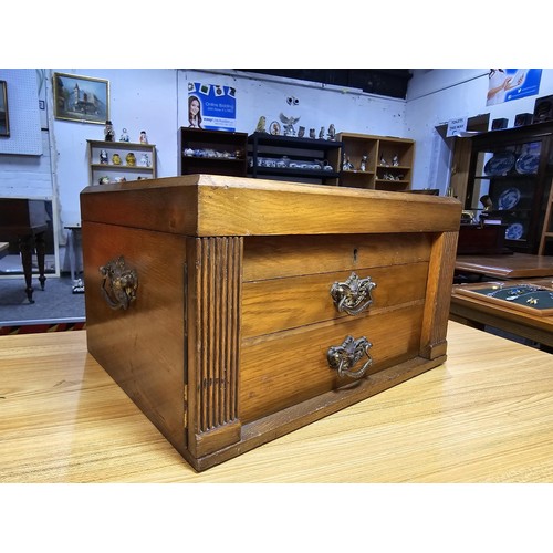 292 - A fine quality and impressive oak cased canteen of cutlery for 12 places by Walker & Hall, all but t... 