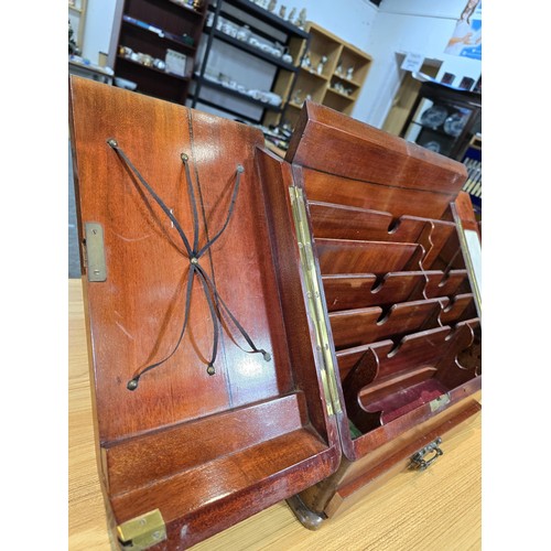 295 - A good quality solid mahogany stationary cabinet of grand proportions which has 2 sloping opening do... 