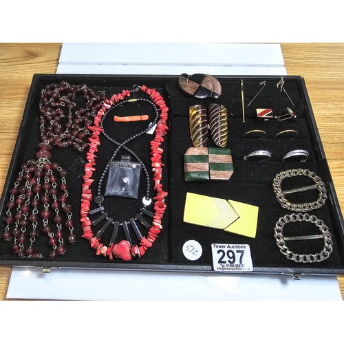 297 - A black display board full of various good costume jewellery which includes a large and impressive g... 