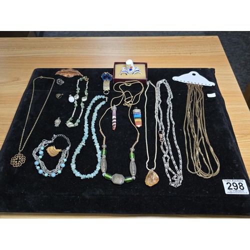 298 - A suite of various costume jewellery which includes hard stone necklaces, multi strand necklaces, Ro... 