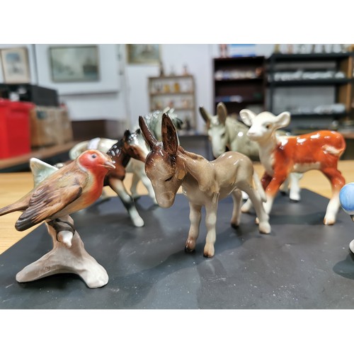 294 - A collection of 7x porcelain animal figures from various makers which includes Beswick, Goebel, H-O ... 