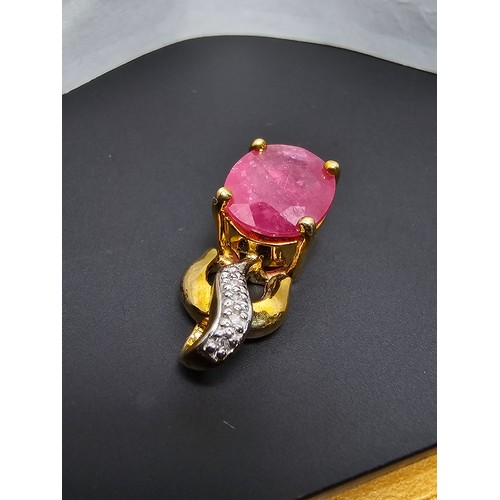 222 - Stunning hallmarked 9ct yellow gold pendant inset with a large oval faceted natural ruby gemstone in... 