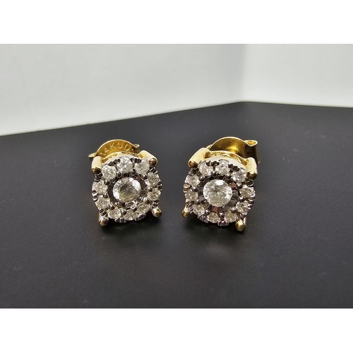 217 - A pair of good quality 14ct yellow gold diamond stud earrings, each earrings is inset with a .064ct ... 