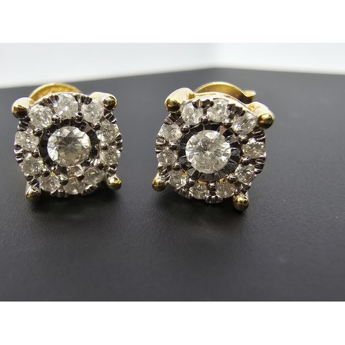 217 - A pair of good quality 14ct yellow gold diamond stud earrings, each earrings is inset with a .064ct ... 