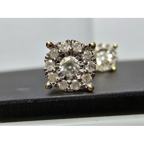 217 - A pair of good quality 14ct yellow gold diamond stud earrings, each earrings is inset with a .064ct ... 