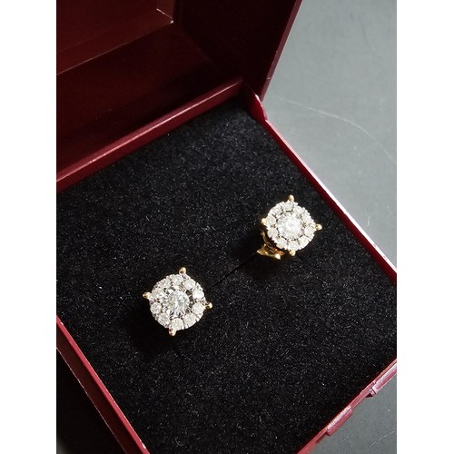 217 - A pair of good quality 14ct yellow gold diamond stud earrings, each earrings is inset with a .064ct ... 