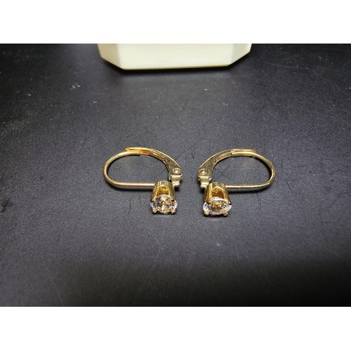 223 - A pair of pretty 14ct yellow gold earrings inset with sparkly crystal cz stones, the earrings appear... 