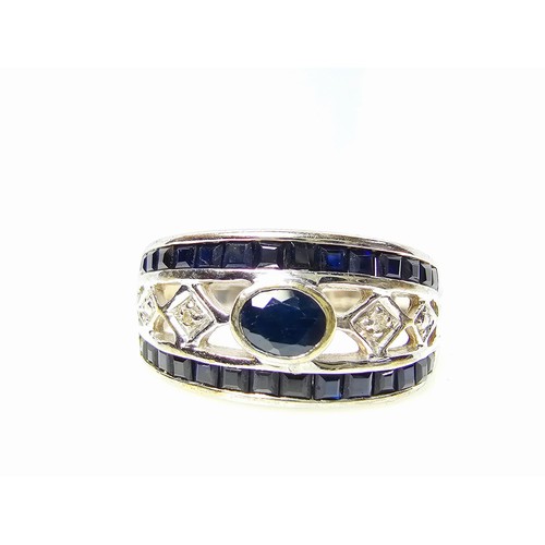 225 - A stunning hallmarked 9ct white gold dress ring inset with a large deep Royal blue sapphire stone to... 