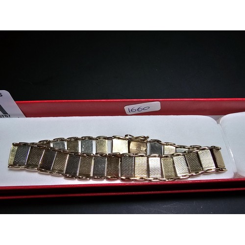 211 - A 9ct tri-colour panel bracelet featuring rose gold, white gold and yellow gold panels, displays ver... 