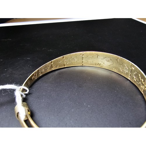 213 - A good quality gold plate on solid 925 sterling silver adjustable bangle, having an engraved star de... 